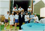 The US container packing team assisted by a very elegantly dressed Australian.