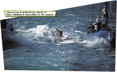 Catching a standing wave in New Zealand between 2 AC boats. Photo by Sharon Green 